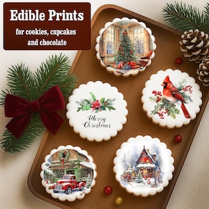 May include: A wooden tray displays several edible prints for cookies, cupcakes, and chocolate. The prints feature Christmas scenes, including a decorated tree, a cardinal, and a red truck. A sprig of pine and a red bow are also present.