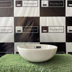 White Marble Countertop Washbasin – Handcrafted Natural Stone Vessel Sink.