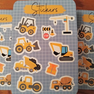 May include: A sheet of construction vehicle stickers with a blue grid background. The stickers feature a forklift, bulldozer, excavator, dump truck, cement mixer, and other construction equipment. The sheet also includes a stop sign, construction cones, and a safety vest.