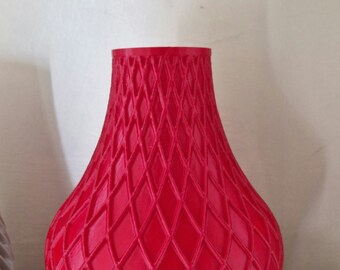 Vaso a nido d'ape rosso stampato in plastica. pla. Altezza 16 cm , larghezza 13 cm.