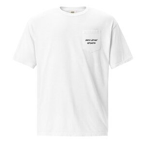 May include: White t-shirt with a pocket on the left chest. The pocket has the text "Started Without Explanation" printed in black. The shirt has short sleeves and a crew neck.