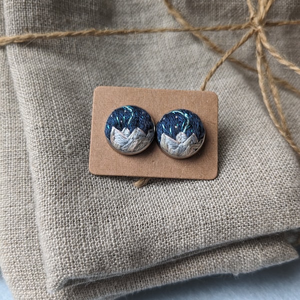 Aurora borealis northern lights earrings - unique hand embroidered stainless steel studs with mountain landscape scenes and a starry sky