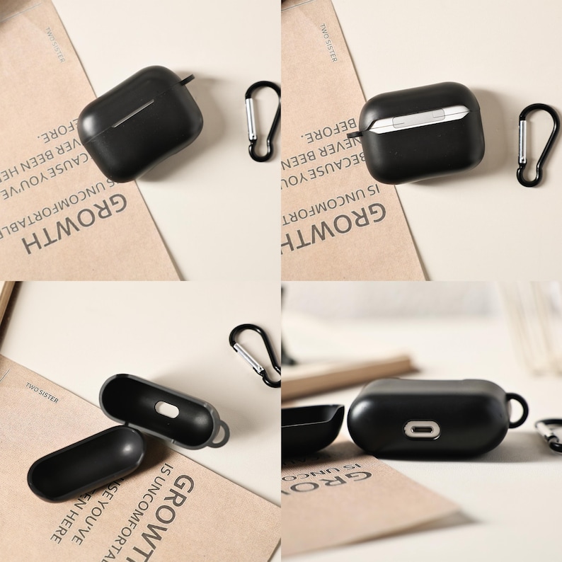 May include: Black protective cases for wireless earbuds, with silver carabiner clips. The cases are shown open and closed, with a sleek, minimalist design. The word "GROWTH" is visible on the background.