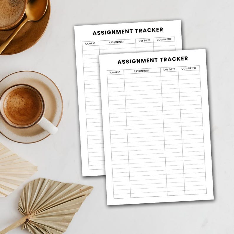 May include: Two white assignment tracker sheets with the text "ASSIGNMENT TRACKER" at the top. Each sheet has columns for course, assignment, due date, and completed. A cup of coffee and decorative leaves are in the background.
