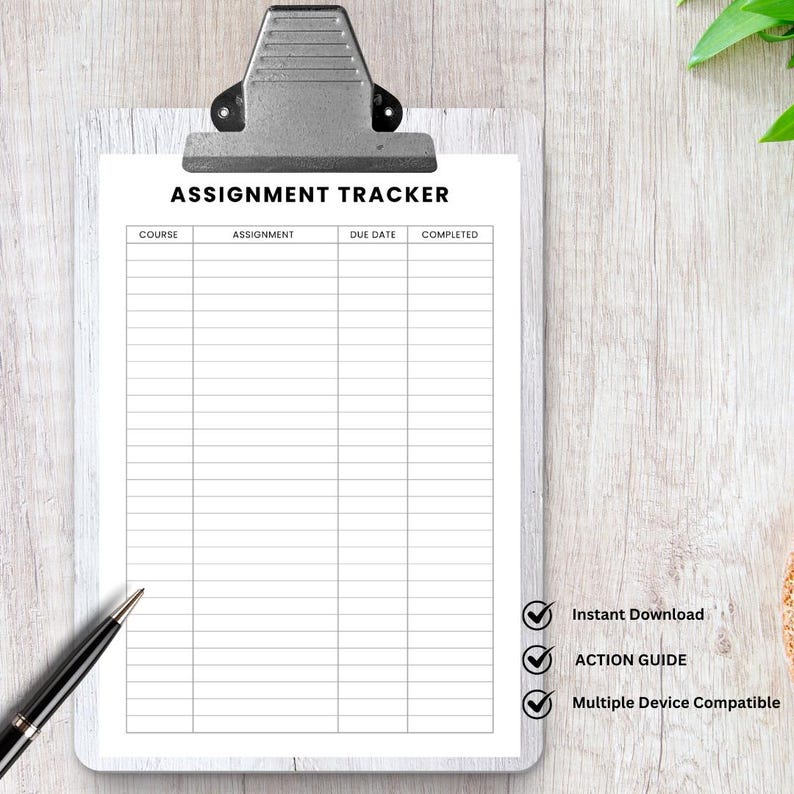 May include: A white assignment tracker sheet titled "ASSIGNMENT TRACKER" in black text, secured by a silver clipboard. The sheet features columns for course, assignment, due date, and completion status. A black pen is positioned on the bottom left.