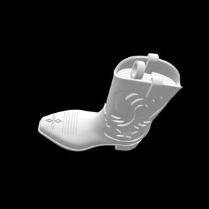 May include: A white cowboy boot with decorative embossed details. The boot features a pointed toe, a heel, and a pull tab. The design includes a floral pattern and vertical lines on the front.