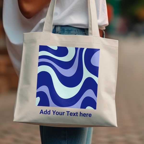 The Abstract Blue Waves Pattern Tote Bag boasts a stylish blue swirl design serving as a reusable grocery shopping bag and a gift for her