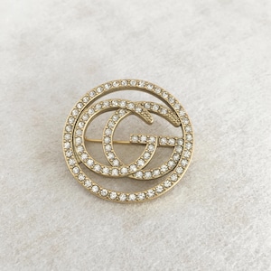Vintage Gucci Brass and Zirconia brooch