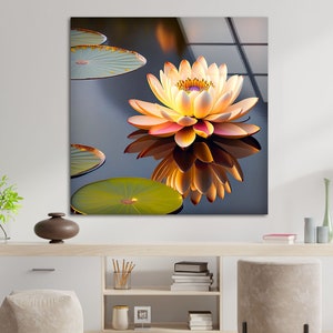 May include: A single yellow and pink water lily with a yellow centre floats on a dark blue pond. The lily is reflected in the water. There are three lily pads in the image.