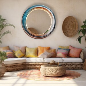 a living room filled with lots of furniture and a round mirror