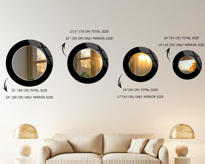 a living room with a white couch and three mirrors on the wall