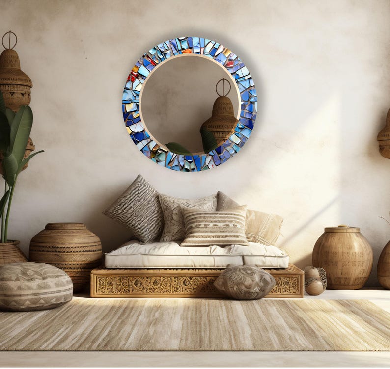 a living room filled with furniture and a round mirror