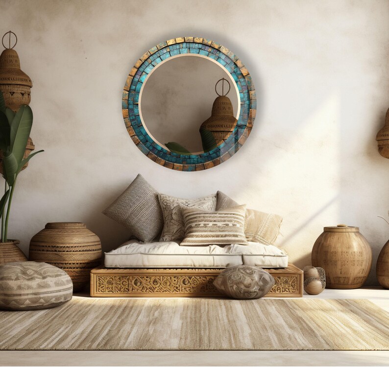 a living room with a couch, mirror and vases