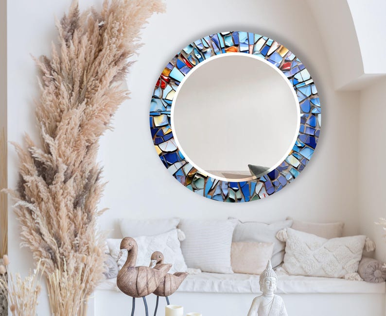 a living room filled with furniture and a round mirror