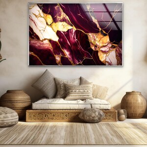 a living room with a couch and a painting on the wall