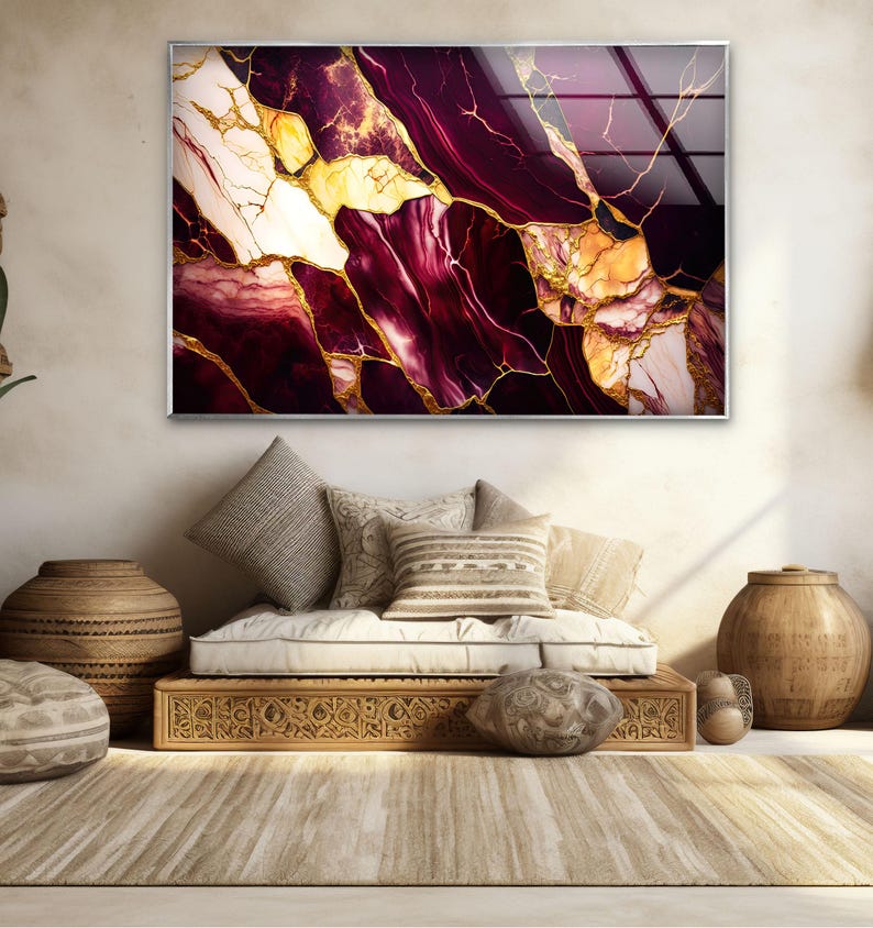 a living room with a couch and a painting on the wall