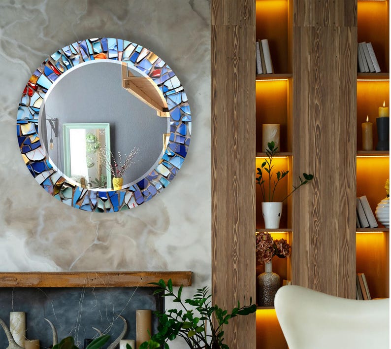 a living room with a fireplace and a mirror on the wall