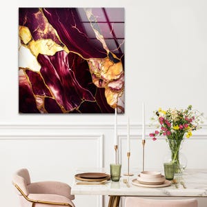 a dining room table with a vase of flowers on it