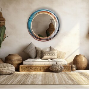 a living room with a couch, mirror and potted plants