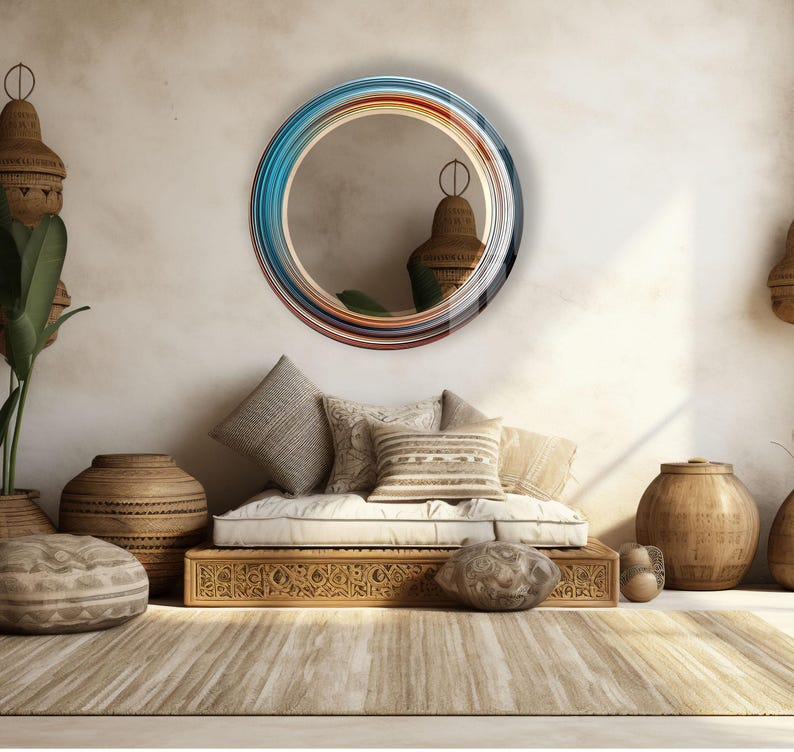 a living room with a couch, mirror and potted plants