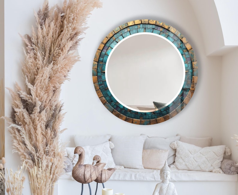 a living room filled with furniture and a round mirror