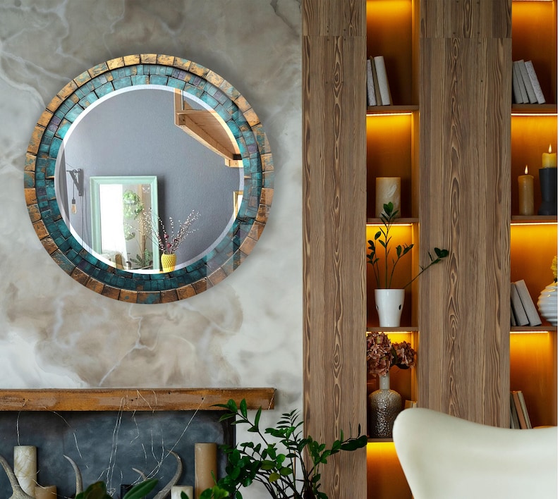 a living room with a fireplace and a round mirror