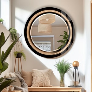 a living room with a round mirror on the wall