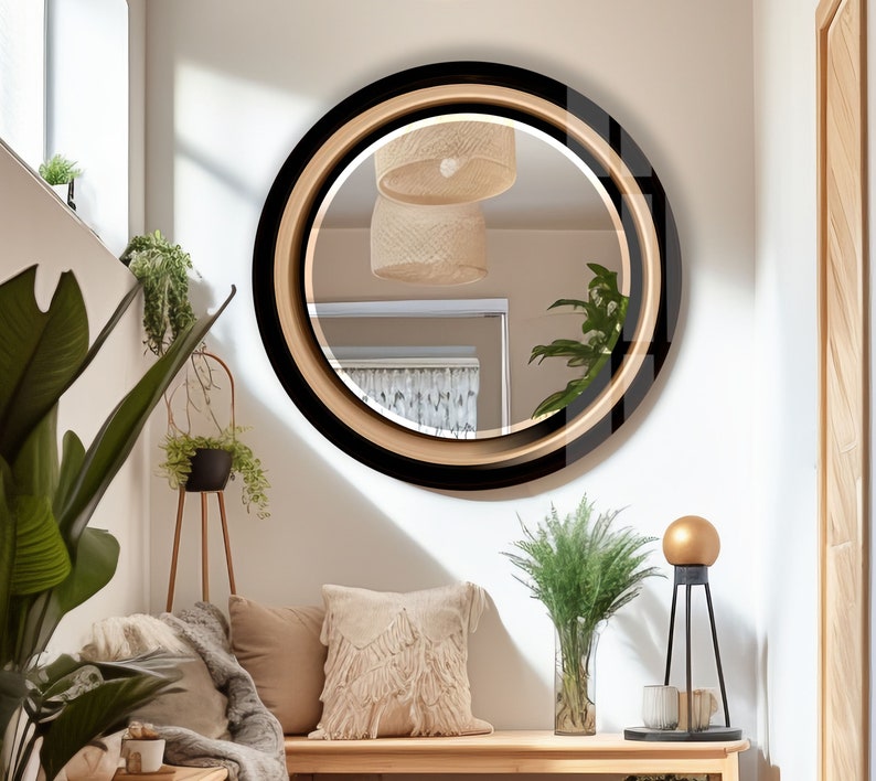 a living room with a round mirror on the wall