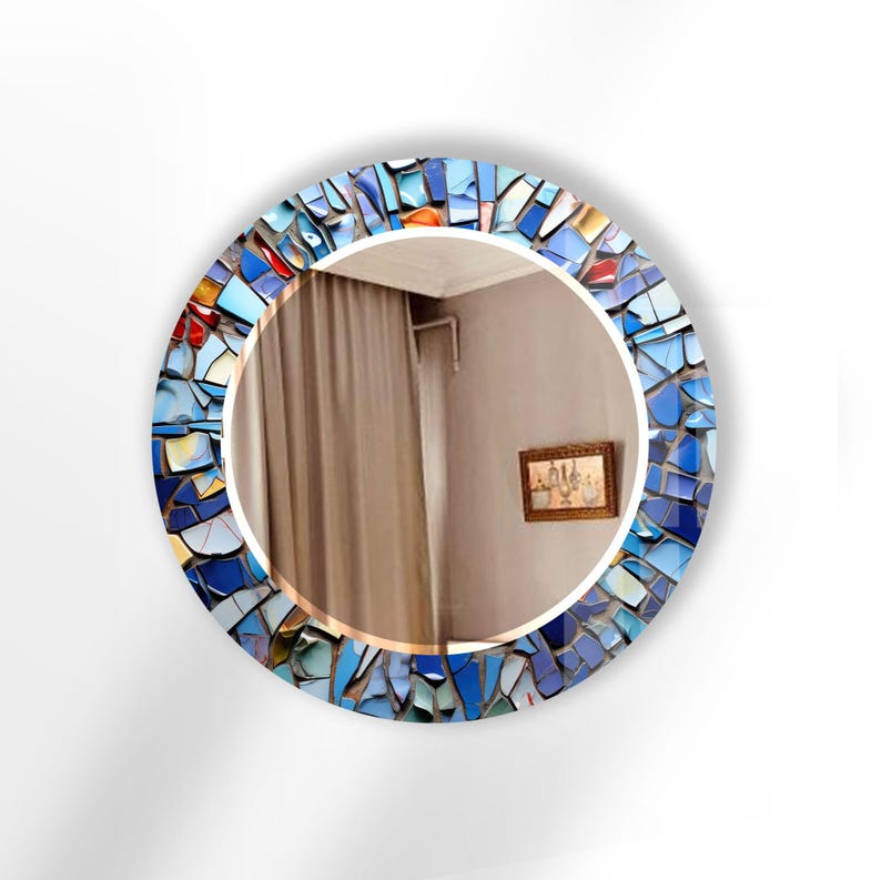 a round mirror with a blue and red mosaic design