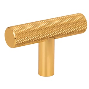 Een gegroefde meubelknop van mat aluminium in een geborstelde gouden kleur – een elegante aanvulling op kasten en lades.