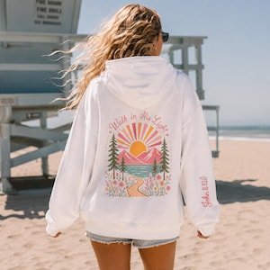 Bible Verse Sweatshirt John 8:12 Scripture Design Walk In His Light Christian Hoodie Teen Girl Youth Camp Faith Wear Inspirational Message Mountain Lake Scene Floral Details Soft Comfortable Cotton Poly Blend Perfect Gift Teenage Daughter