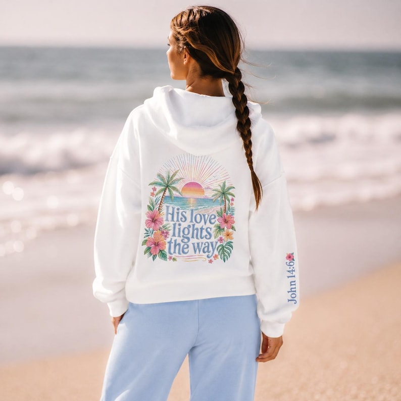 Jesus Love Theme Teenage Gift Bible Verse Hoodie Christian Women Faith Inspired Pullover Sweatshirt Teen Girl Youth Group Shirt Religious Camp Apparel Ocean Tropical Sunrise Scene Palm Tree Design His Love Lights Way Back Text John Verse
