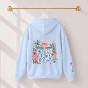 Jesus Love Theme Teenage Gift Bible Verse Hoodie Christian Women Faith Inspired Pullover Sweatshirt Teen Girl Youth Group Shirt Religious Camp Apparel Ocean Tropical Sunrise Scene Palm Tree Design His Love Lights Way Back Text John Verse