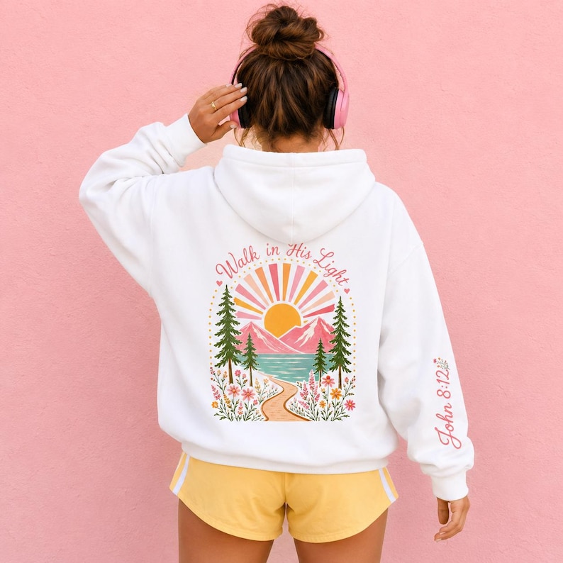 Walk In His Light Christian Sweatshirt Mountain Lake Scene Design Bible Verse Hoodie Teen Girl Cursive Text Back Floral Sleeve Details Sun Flower Front Youth Camp Faith Clothing Soft Cotton Poly Blend Inspirational Gift Teenage Daughter