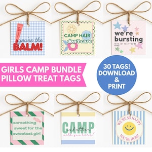 May include: A set of square paper gift tags with twine bows, featuring various colorful designs and text including 'you're the BALM!', 'CAMP HAIR don't care', 'we're bursting', 'something sweet for the sweetest girl', 'CAMP is better', and 'WE'RE SO HAPPY YOU'RE HERE!'