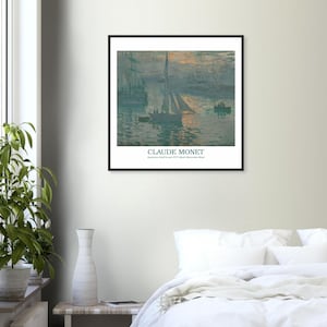 May include: A framed print of Claude Monet's "Impression, soleil levant" (Sunrise). The artwork depicts a harbor scene with boats and a sailboat, rendered in shades of blue, gray, and orange. The artist's name and artwork title are printed below the image.