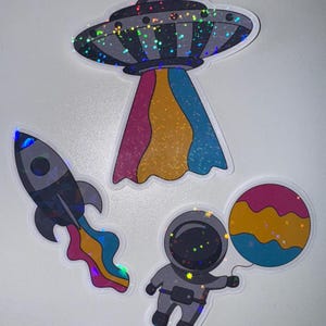 Pegatinas con brillantina de astronauta, cohete, ovni, bandera del orgullo pansexual, calcomanía holográfica de la bandera del orgullo con temática espacial LGBTQ+, calcomanía del mes del orgullo galáctico
