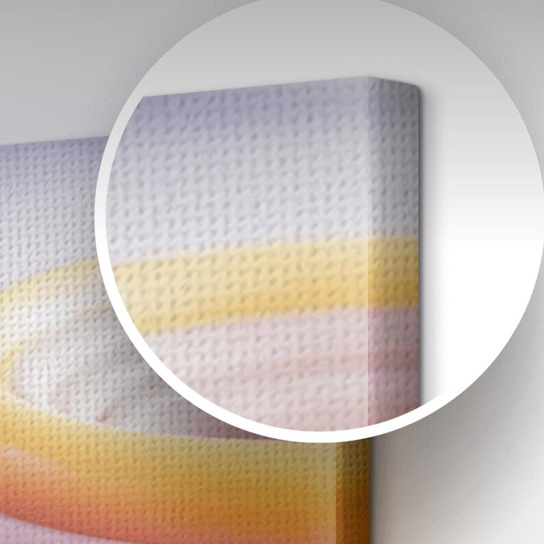 The image is a close-up of a canvas print with a textured background featuring a gradient of colors, including shades of yellow, orange, and pink.