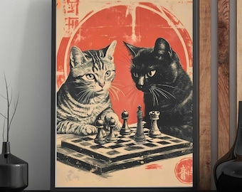 May include: Framed art print featuring two cats playing chess. One cat is black, the other is tabby. The background is a red circle with Japanese text. The chess board is in the center of the image.