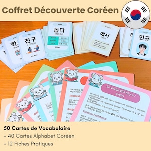 May include: A set of educational flashcards for learning Korean, featuring vocabulary cards with Hangul text, illustrations, and romanization, alongside instructional cards with French text and cartoon mouse graphics, all displayed in a collection.