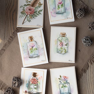 Here you can see more handmade watercolor greeting cards, featuring a flowers inside the bottle theme.