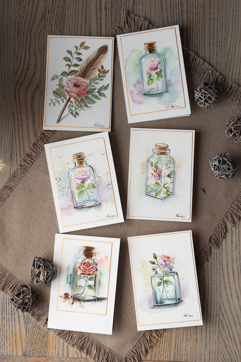 Here you can see more handmade watercolor greeting cards, featuring a flowers inside the bottle theme.