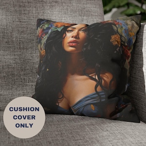 May include: Cushion cover featuring a portrait of a woman with long, dark hair adorned with flowers. The woman is wearing a blue top. The text "CUSHION COVER ONLY" is printed on a light beige circle.
