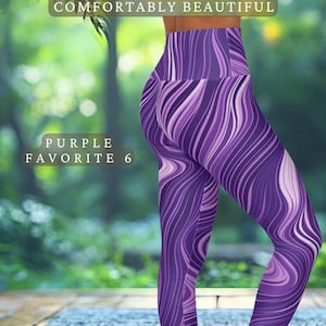 May include: Purple leggings with a flowing, abstract design in shades of purple and white. The leggings feature the text "LEGGINS COMFORTABLY BEAUTIFUL" and "PURPLE FAVORITE 6". The Etsy shop name "CRAFTYHARMONIES.ETSY.COM" is also visible.