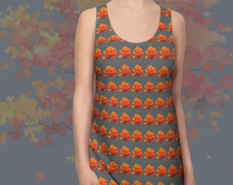 May include: Racerback dress featuring a grey background and a repeating pattern of orange and yellow autumn leaves. The dress has a scoop neckline and is sleeveless. The text "AUTUMN LEAVES 2" is visible.