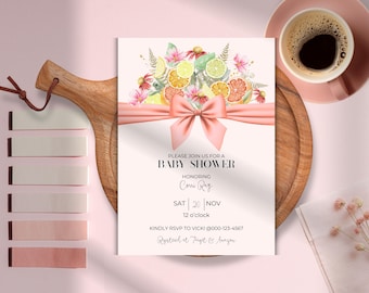 May include: A pink and white baby shower invitation with a watercolor illustration of lemons, limes, and flowers tied with a pink bow. The text reads "Please join us for a baby shower honoring Corrie Ray Sat 20 Nov 12 o'clock Kindly RSVP to Vicki @000-123-4567 Registered at Target & Amazon"