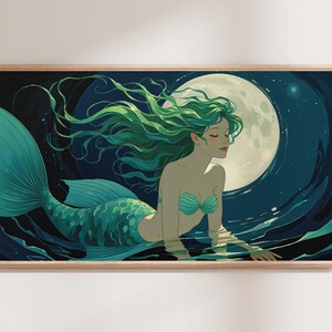 May include: A framed art print featuring a mermaid in teal and green hues, with flowing green hair, a teal tail, and a teal seashell top. The mermaid is in water, with a full moon in the background. The artwork is in a wooden frame.