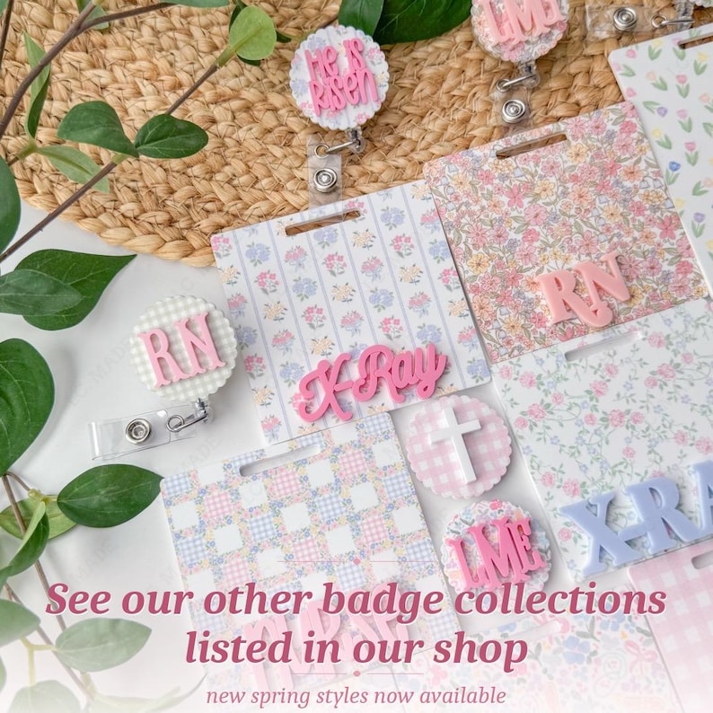 May include: A collection of floral and patterned badge reels and name tags. The tags feature pink and blue floral patterns, with pink lettering that reads "RN", "K-Ray", and "He is Risen". The image also includes the text "See our other badge collections listed in our shop".