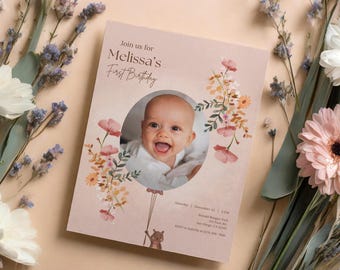 May include: A pink and white floral birthday invitation with a photo of a baby girl in a white shirt. The invitation says "Join us for Melissa's First Birthday".