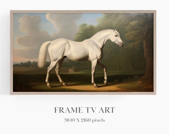 May include: A painting of a white horse standing in a field with trees in the background. The horse is facing to the left and has a long tail. The painting is framed in a light wood frame.